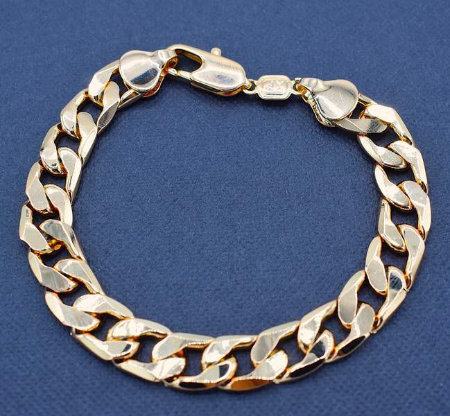 Tukeva kullanvärinen ketjuranneke