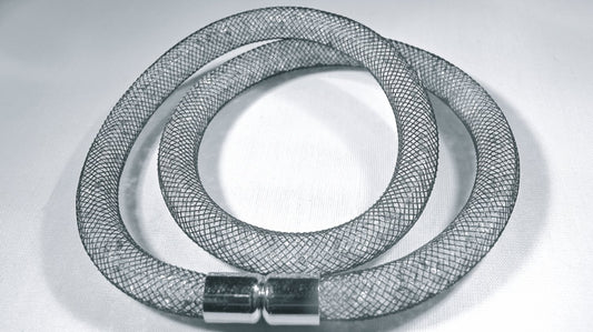 Double black bracelet filled with white crystals